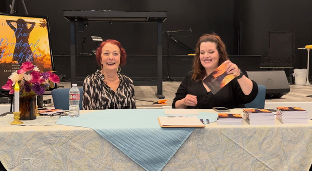 Agnes Schultz at a book-signing table