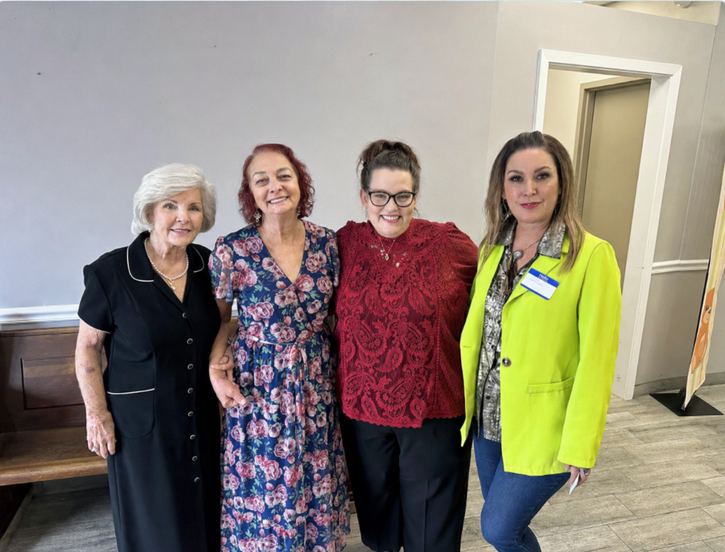 Four women attending a Purelilly Press community gathering