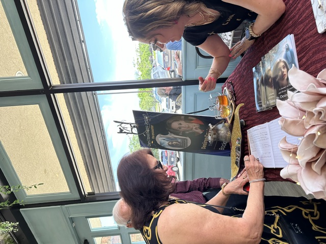A reader meeting Desiree Dantas at her signing table